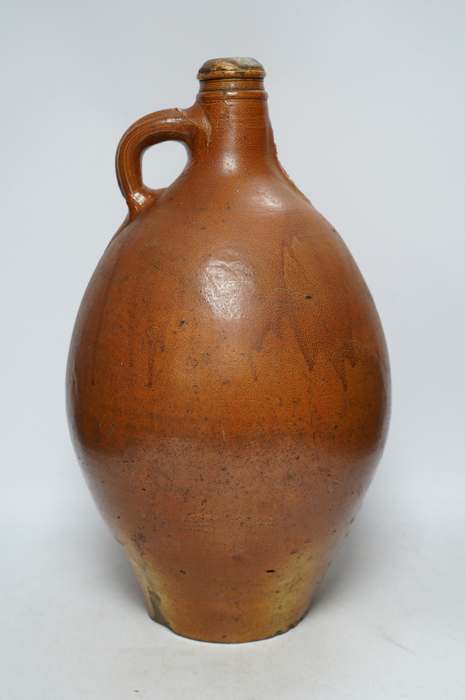 An 18th century German large salt glazed Bellarmine, 45cm. Condition - commensurate with age